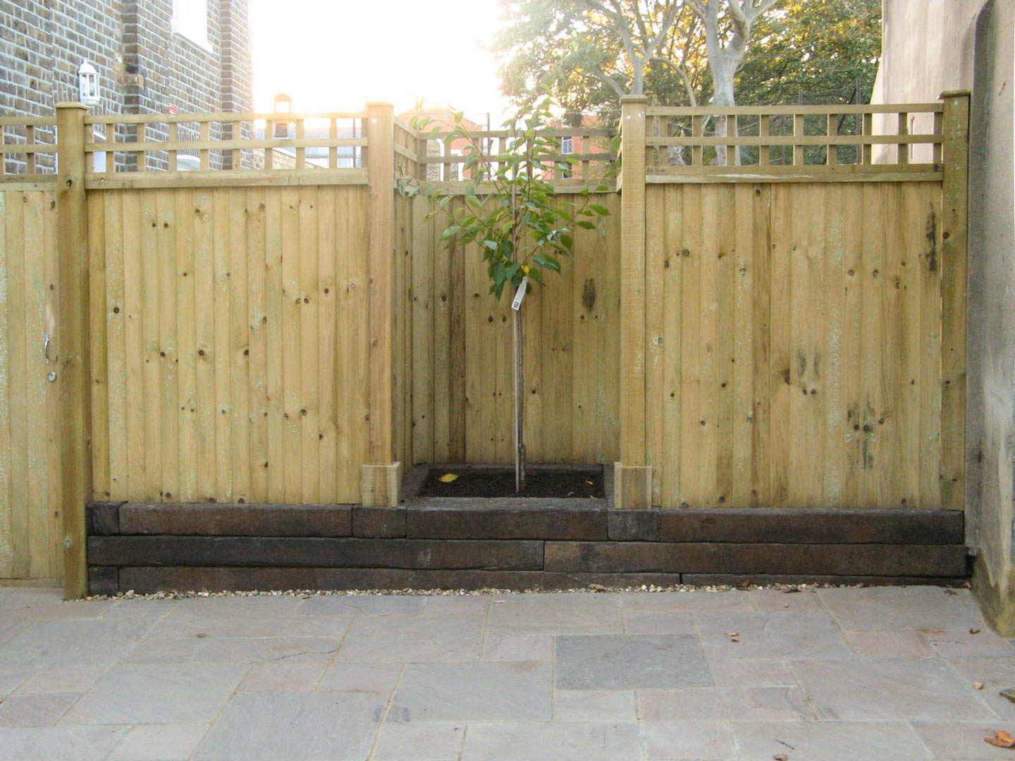 garden fence with tree feature